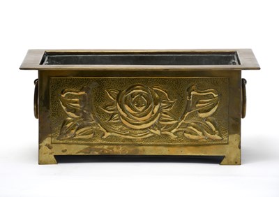 Lot 477 - A Glasgow School brass planter with liner in...
