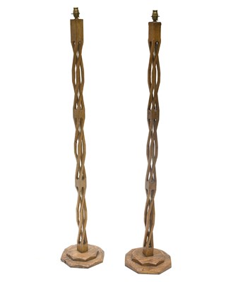 Lot 184 - A near pair of Helix oak standard lamps, on...