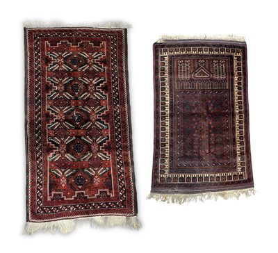Lot 348 - An antique wool Baluch or Taimani prayer rug,...