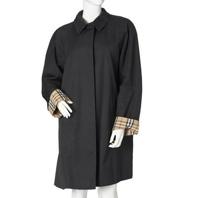 Lot 303 - Burberry, a ladies navy blue trench coat.