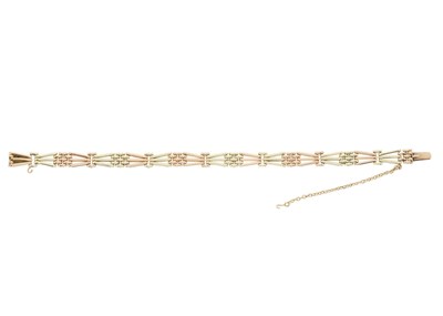 Lot 186 - A Russian 14ct bi-colour gold gate bracelet