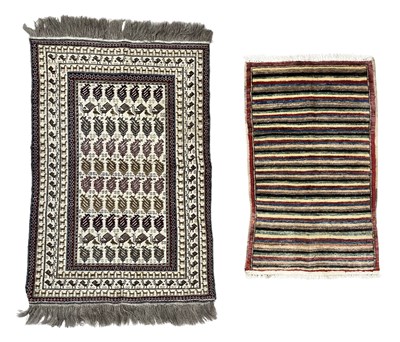 Lot 339 - A wool rug with geometric zoomorphic designs,...