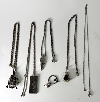 Lot 246 - Five silver pendants, with chains