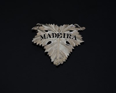 Lot 102 - A Victorian cast silver vine leaf wine label...