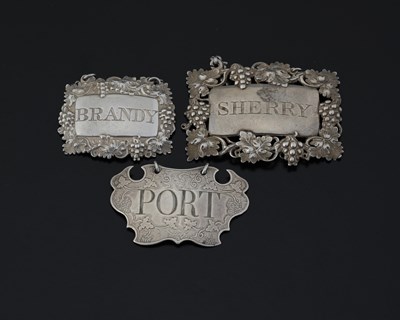 Lot 184 - A group of three hallmarked silver wine labels...