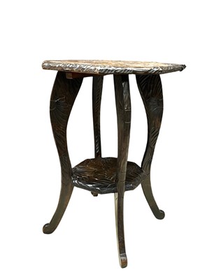 Lot 369 - An early 20th Japanese style heavilly carved...