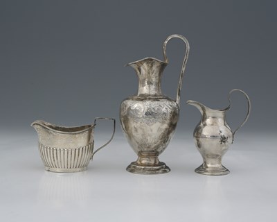 Lot 183 - A group of three silver milk jugs, nineteenth...