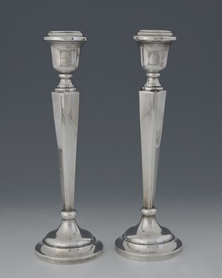 Lot 101 - A pair of Elizabeth II silver candlesticks, by...