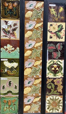 Lot 212 - A collection of relief moulded floral tiles,...
