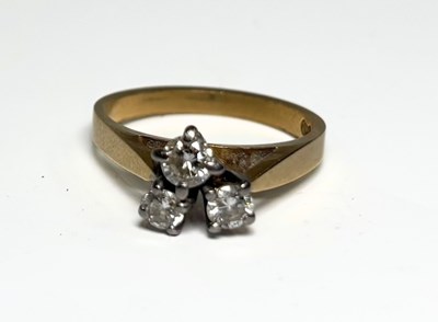 Lot 233 - An 18ct gold diamond three-stone ring