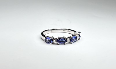 Lot 256 - A 14ct gold tanzanite and diamond dress ring