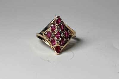 Lot 258 - A 14ct gold ruby and diamond dress ring