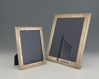 Lot 84 - Two Elizabeth II silver-mounted photograph...