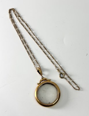 Lot 268 - An early 20th century 9ct gold glazed locket, with later 9ct gold chain