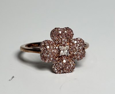 Lot 260 - A 9ct gold pink diamond and diamond floral cluster ring