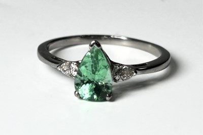 Lot 263 - A platinum tourmaline and diamond three-stone ring