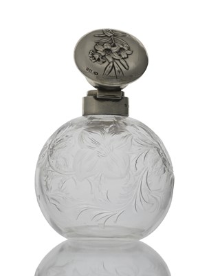 Lot 133 - An Edwardian silver-topped perfume bottle, by...