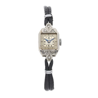 Lot 245 - A white metal diamond set cocktail watch