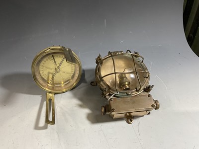 Lot 181 - A brass bulkhead engine light and an Elliot...