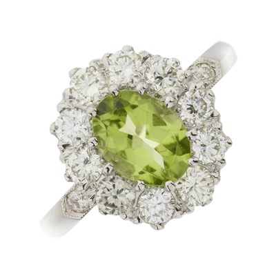 Lot 67 - A platinum peridot and diamond cluster ring