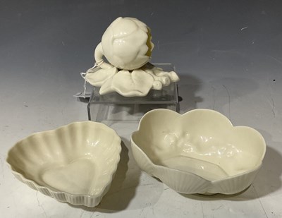Lot 100 - A Belleek dish formed as shells with yellow...