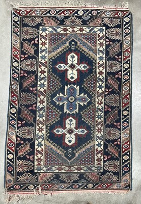 Lot 335 - A wool rug, Afghan Shirvan type, central...