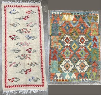 Lot 342 - A woven rug or runner, central panel of...