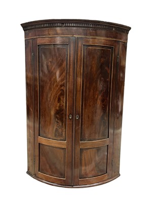 Lot 356 - A Georgian bow fronted, wall-mounted corner...