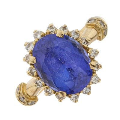 Lot 142 - A gold tanzanite and diamond cluster ring