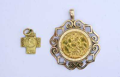 Lot 29 - A gold sovereign pendant, and a gold cross pendant