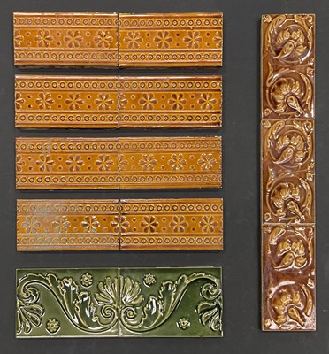 Lot 186 - A collection of majolica glazed border tiles,...