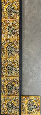 Lot 274 - A set of seven majolica relief moulded tiles,...