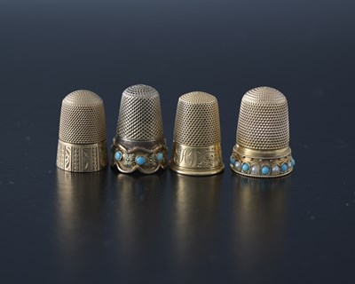 Lot 25 - Four nineteenth-century gold-coloured metal...