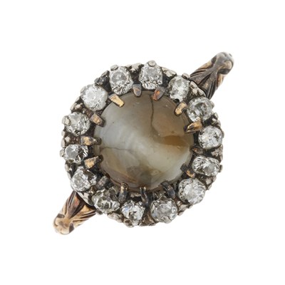 Lot 17 - A late Victorian gold and silver, cat's eye chrysoberyl and diamond cluster ring