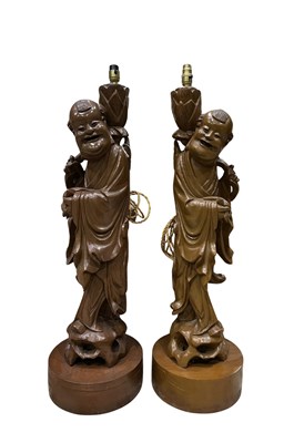 Lot 83 - A large pair of mid century carved hardwood...