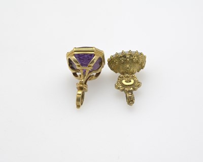 Lot 7 - Two intaglio engraved gem set gold coloured...