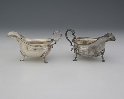 Lot 210 - Two twentieth-century silver sauceboats, to...