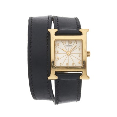 Lot 214 - Hermès, an 18ct gold Heure H Mini wrist watch