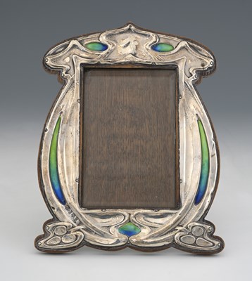 Lot 99 - An Arts and Crafts silver and enamelled photo...