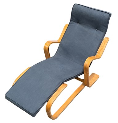 Lot 207 - A bent-ply and birch Long chair designed by...