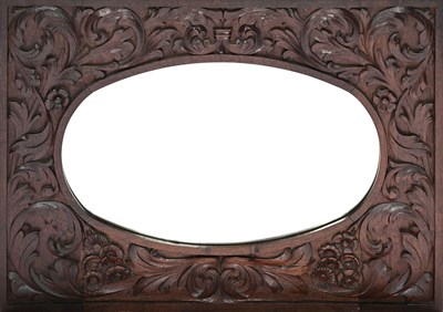 Lot 434 - A carved wood wall mirror probably Irish,...