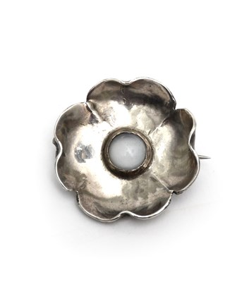 Lot 60 - A silver and moonstone brooch in the manner of...