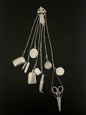 Lot 66 - A Victorian white metal chatelaine, the clip...