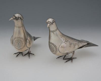 Lot 17 - A pair of Persian silver-coloured metal...