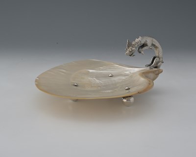 Lot 14 - A twentieth-century mother-of-pearl dish, the...