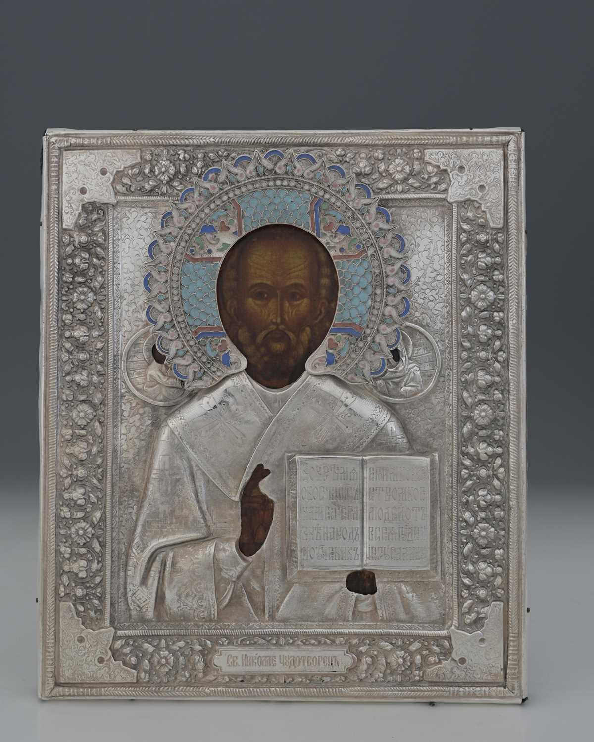 Lot 12 - A Russian icon, with decoration depicting