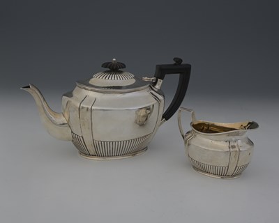 Lot 267 - A Victorian silver teapot and milk jug, by...