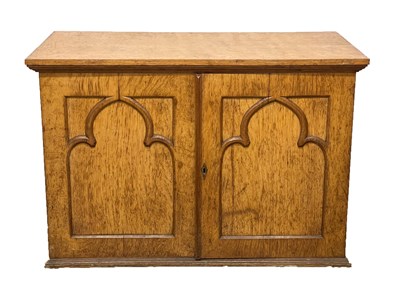 Lot 498 - A Gothic Revival oak coin collectors cabinet,...