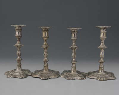 Lot 302 - Two pairs of William IV silver candlesticks,...