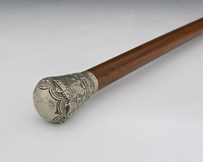 Lot 215 - An Indian white metal mounted malacca stick,...